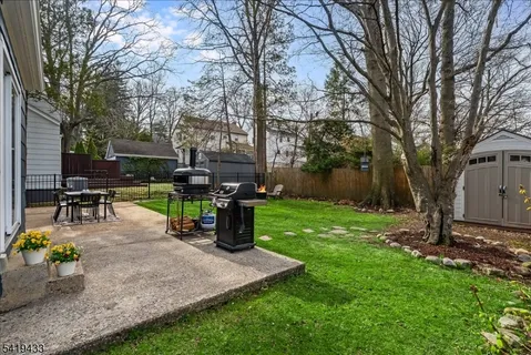 a view of a backyard with sitting area
