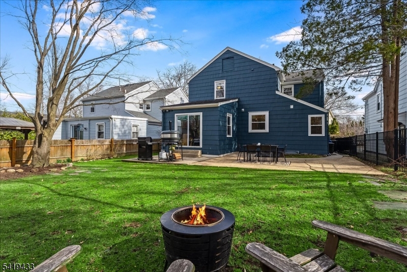 4 Rynda Road Maplewood, NJ 07040 - Photo 33 of 34 a front view of a house with garden