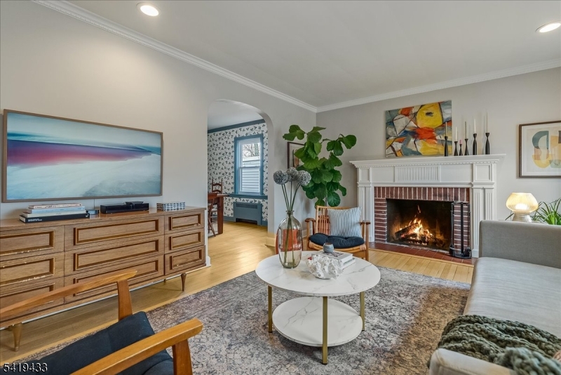 4 Rynda Road Maplewood, NJ 07040 - Photo 5 of 34 a living room with furniture and a fireplace