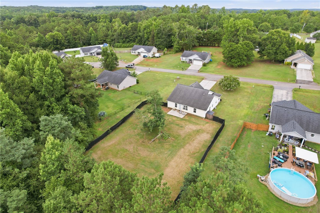 105 Lacy Lane Anderson, SC 29621 - Photo 15 of 16 An aerial perspective reveals a residential community nestled among mature trees with ample yard space.