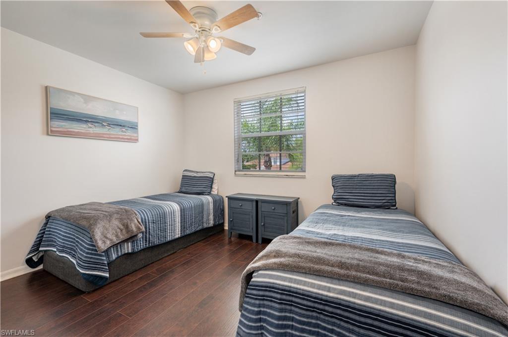 367 Dover Place, Unit 1002 Naples, FL 34104 - Photo 22 of 31 a bedroom with bed and a window
