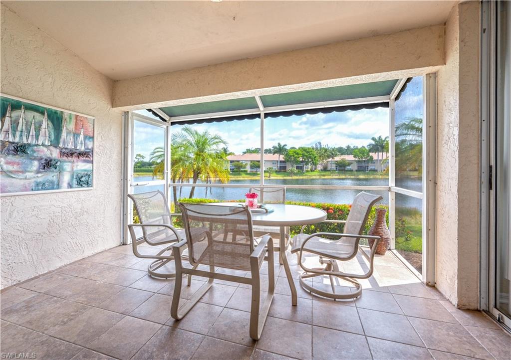 367 Dover Place, Unit 1002 Naples, FL 34104 - Photo 24 of 31 a dining room with furniture and floor to ceiling windows