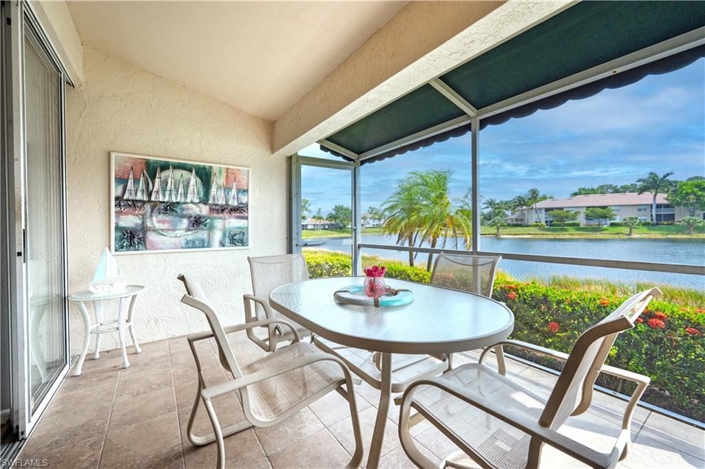 367 Dover Place, Unit 1002 Naples, FL 34104 - Photo 25 of 31 a view of a dining room with furniture window and outside view