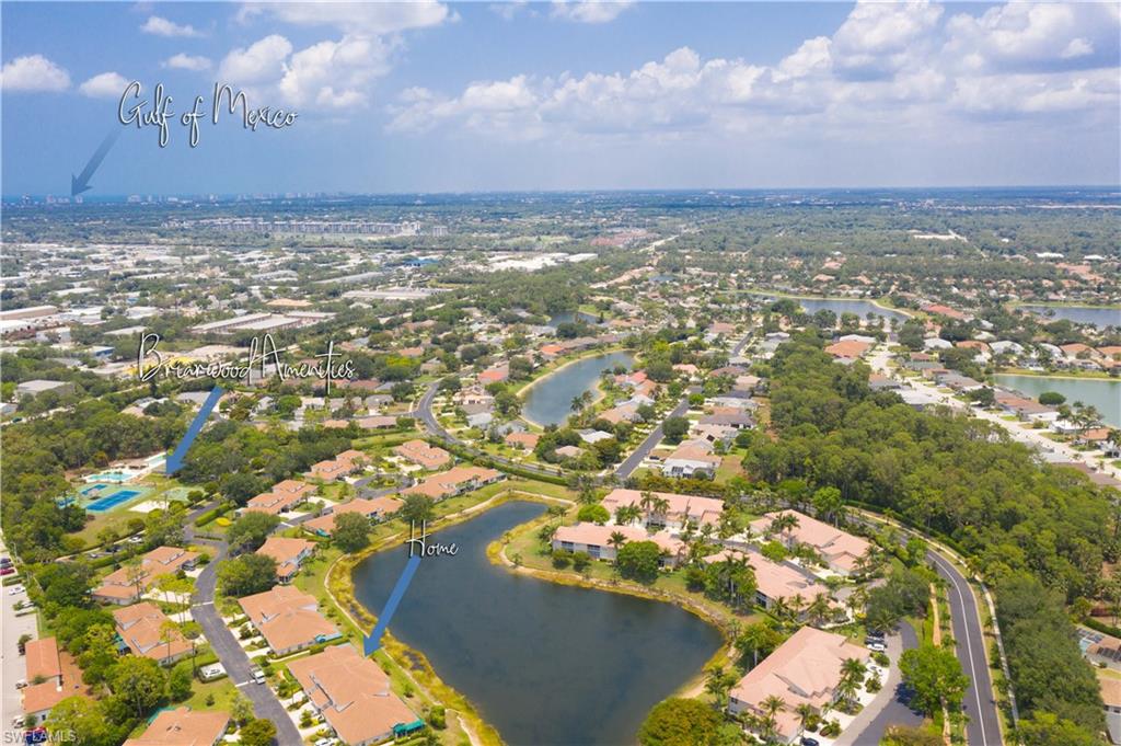367 Dover Place, Unit 1002 Naples, FL 34104 - Photo 28 of 31 an aerial view of residential building with yard