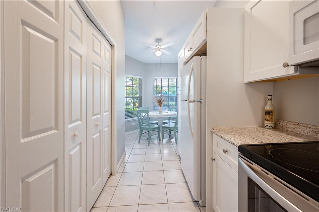 367 Dover Place, Unit 1002 Naples, FL 34104 - Photo 10 of 31 a view of a kitchen with a sink