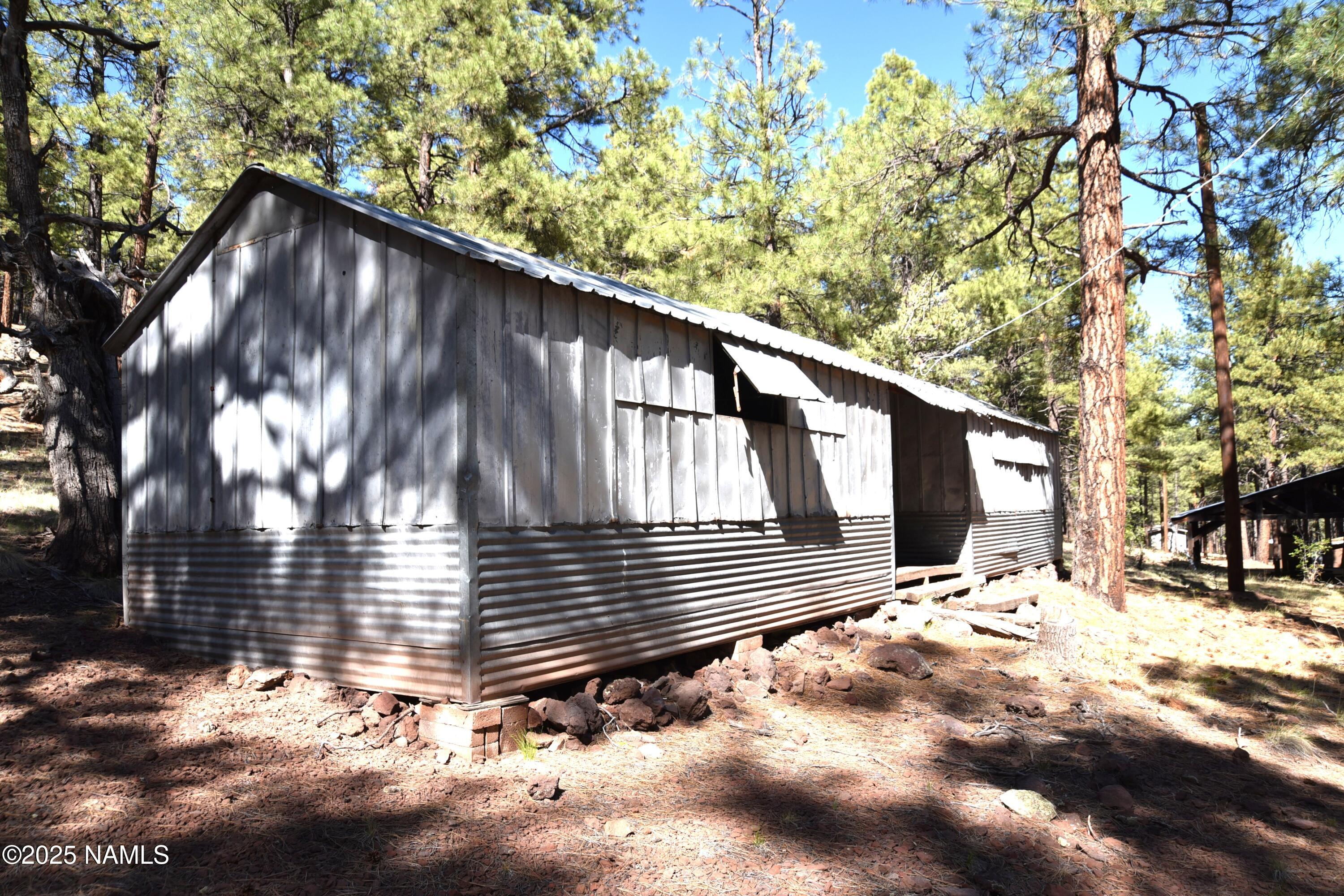7145 East 4h Club Camp Road Williams, AZ 86046 - Photo 17 of 35 a view of wooden fence and a pathway