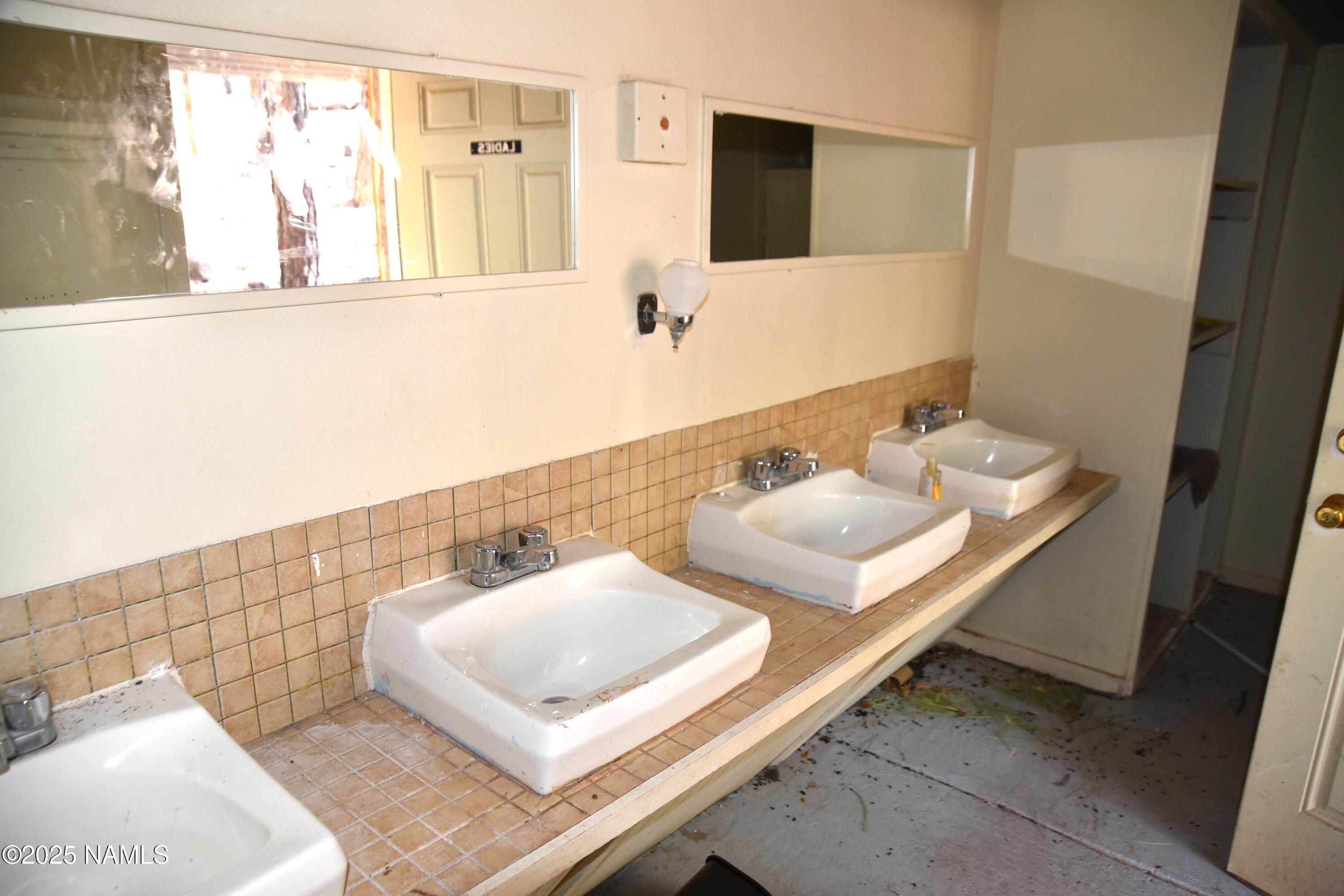 7145 East 4h Club Camp Road Williams, AZ 86046 - Photo 21 of 35 a bathroom with a sink and a mirror