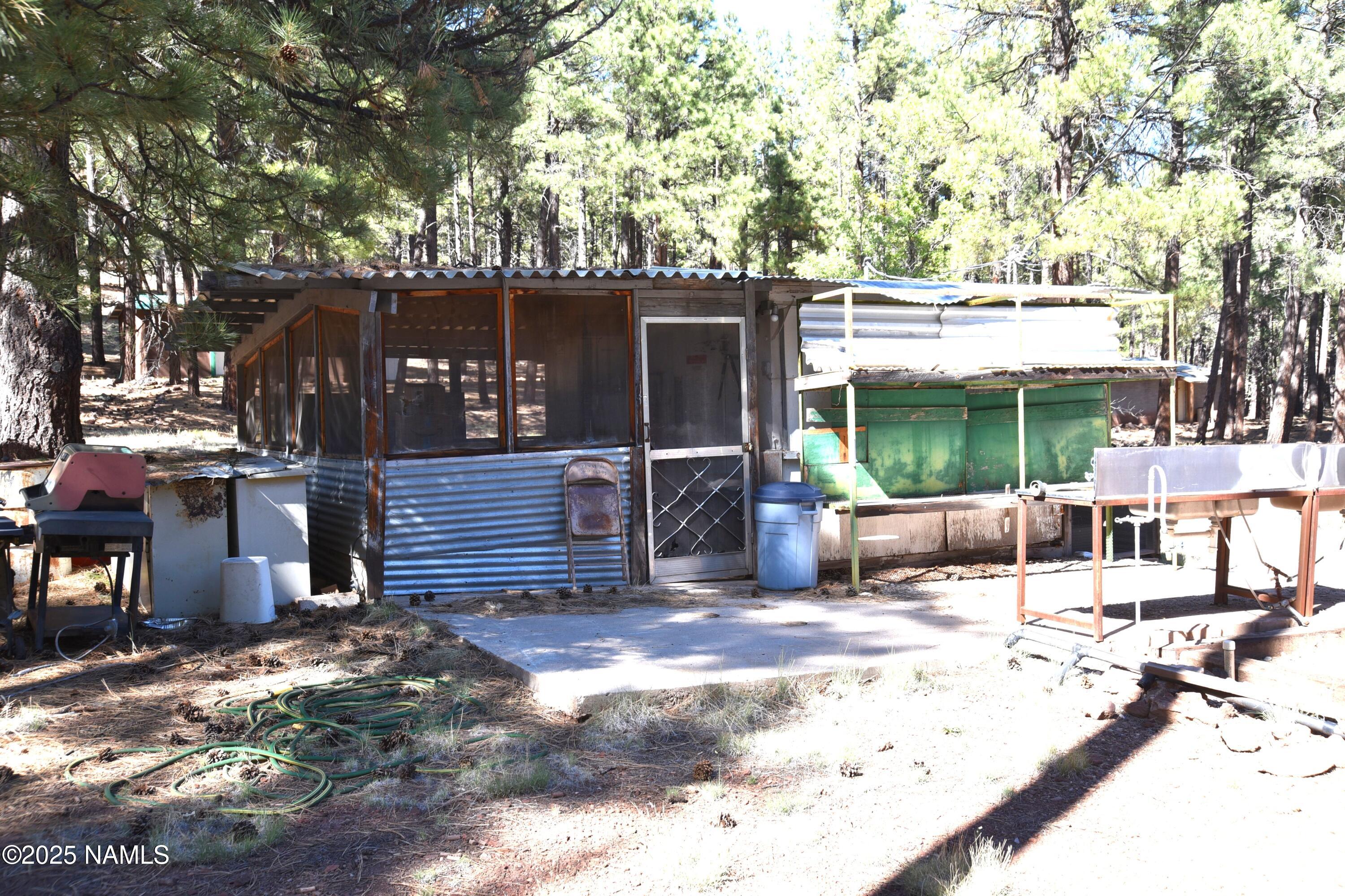 7145 East 4h Club Camp Road Williams, AZ 86046 - Photo 28 of 35 a view of a house with a yard and wooden fence