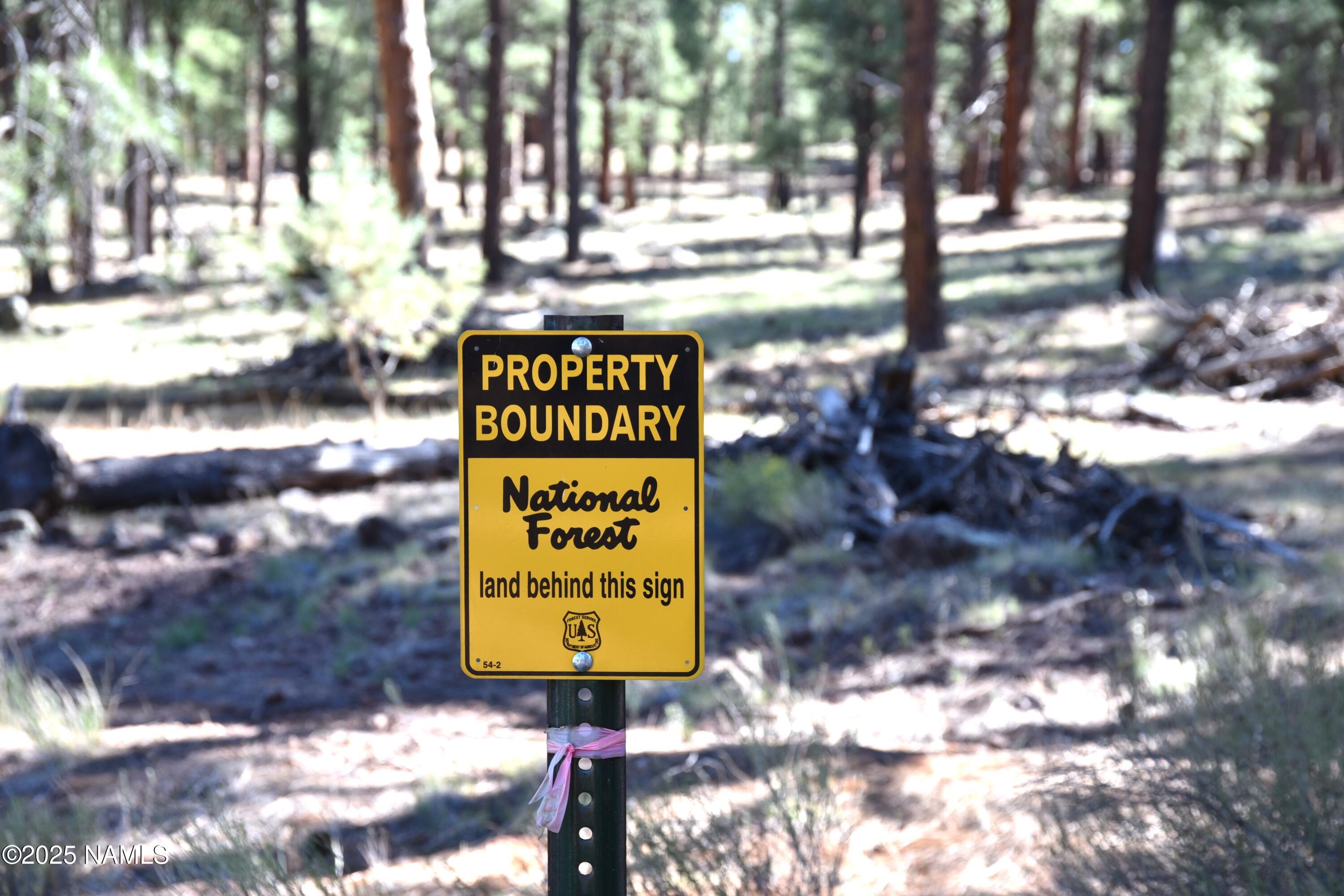 7145 East 4h Club Camp Road Williams, AZ 86046 - Photo 34 of 35 a sign that is on a brick wall