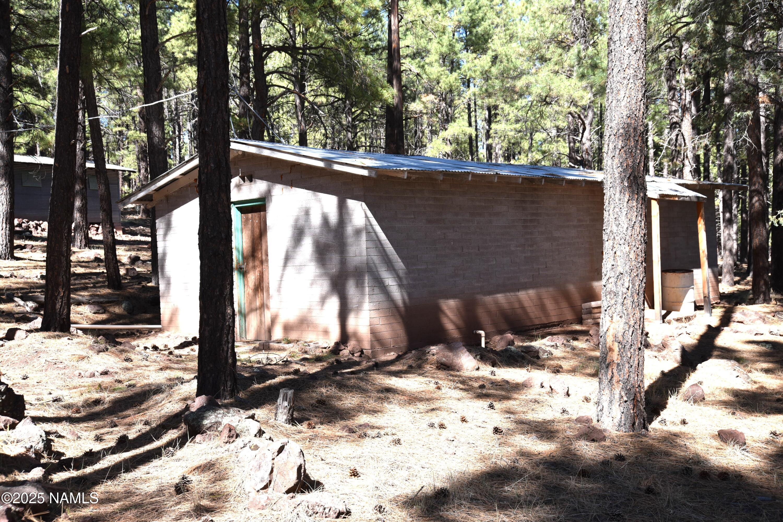 7145 East 4h Club Camp Road Williams, AZ 86046 - Photo 4 of 35 a view of a pathway of a house