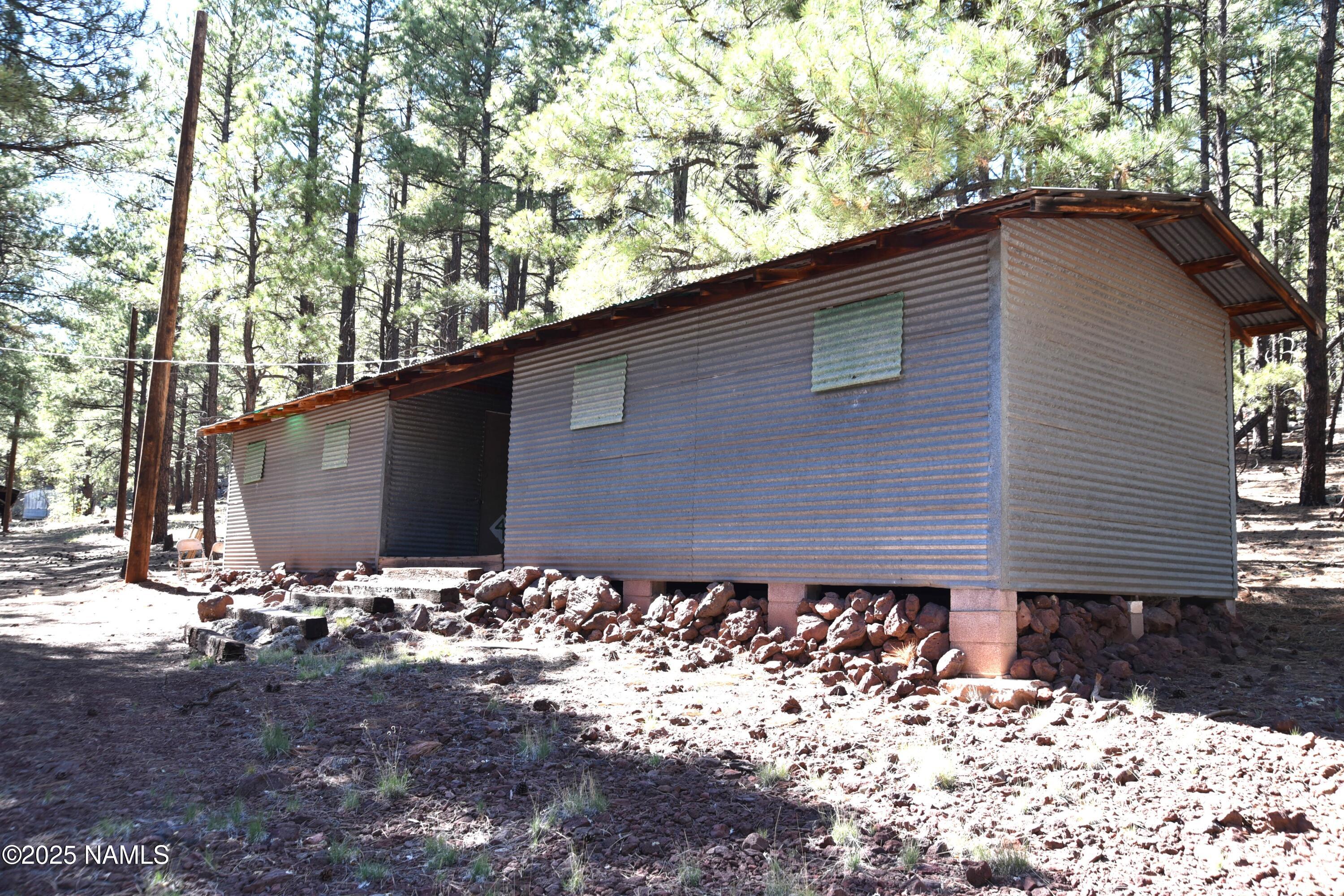 7145 East 4h Club Camp Road Williams, AZ 86046 - Photo 9 of 35 a backyard of a house