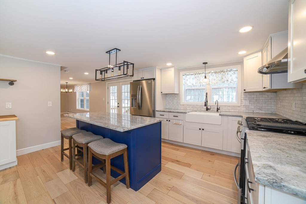 3 Woods Road Westminster, MA 01473 - Photo 4 of 42 a kitchen with sink cabinets and wooden floor