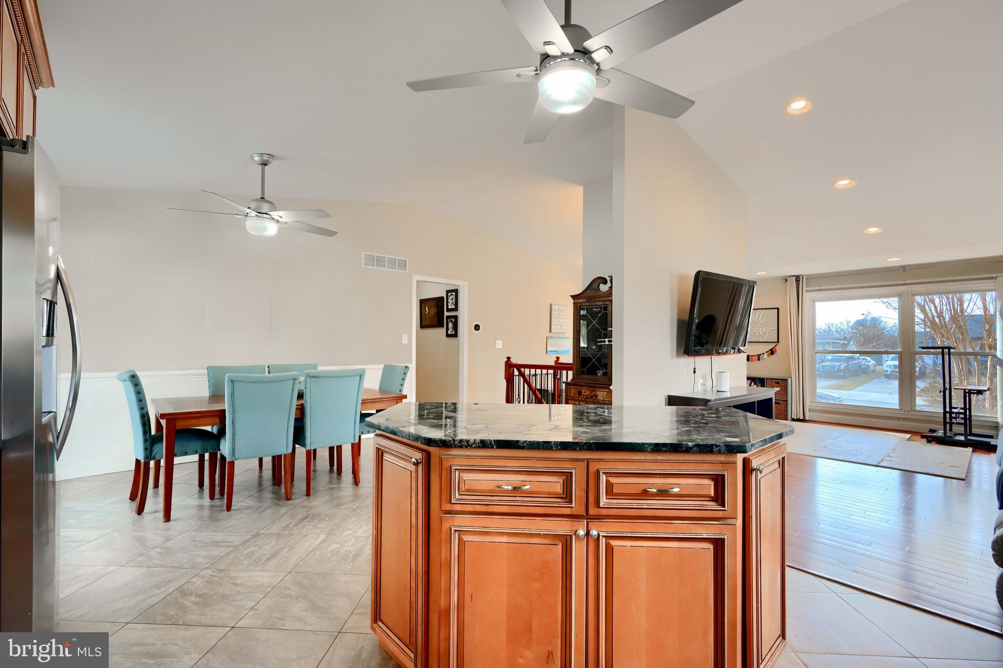 8232 Scotts Level Road Baltimore, MD 21208 - Photo 7 of 69 a kitchen with stainless steel appliances granite countertop a sink a stove and a refrigerator