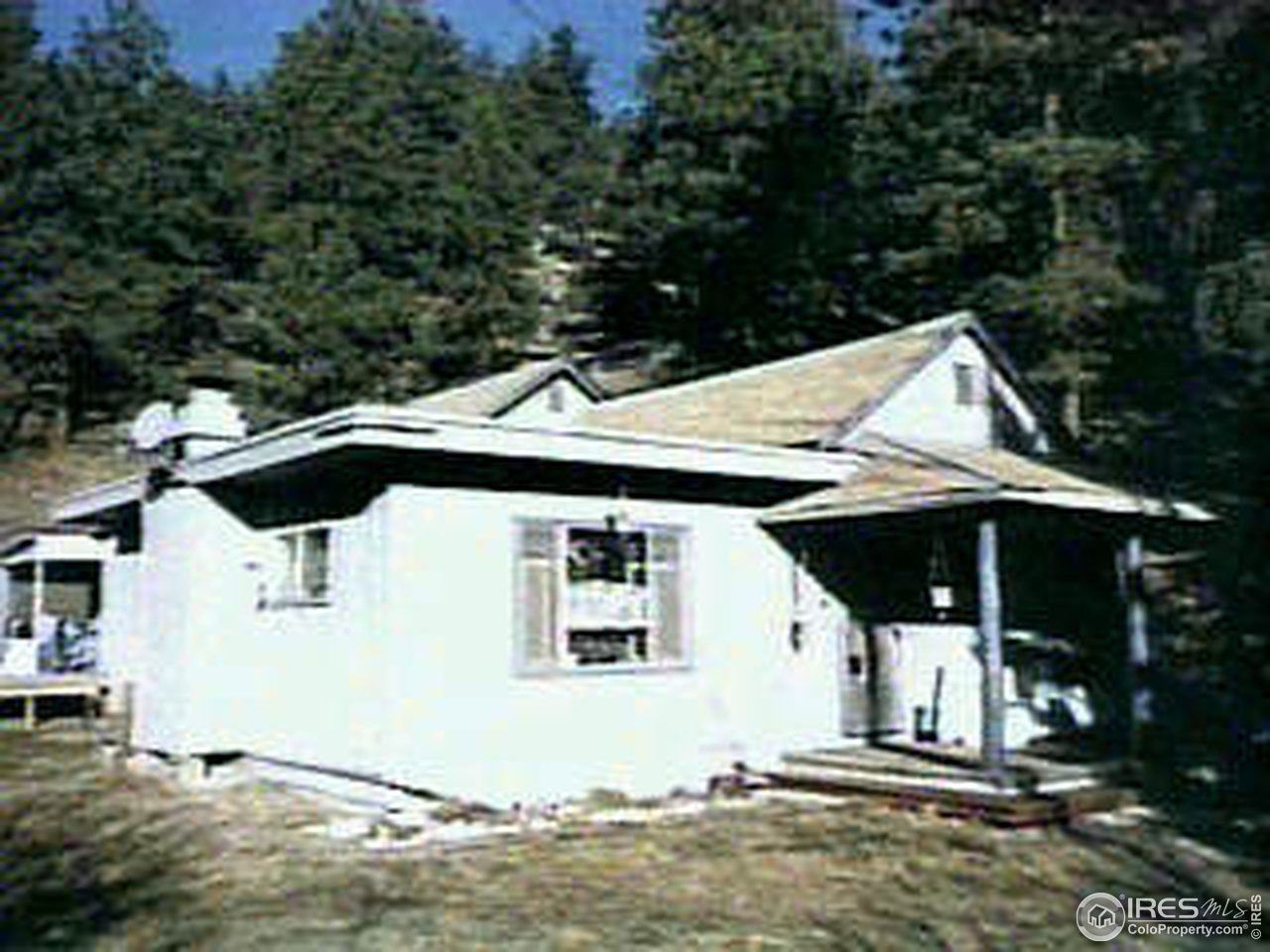 34 Logan Mill Road Boulder, CO 80302 - Photo 1 of 1 a house with trees in the background
