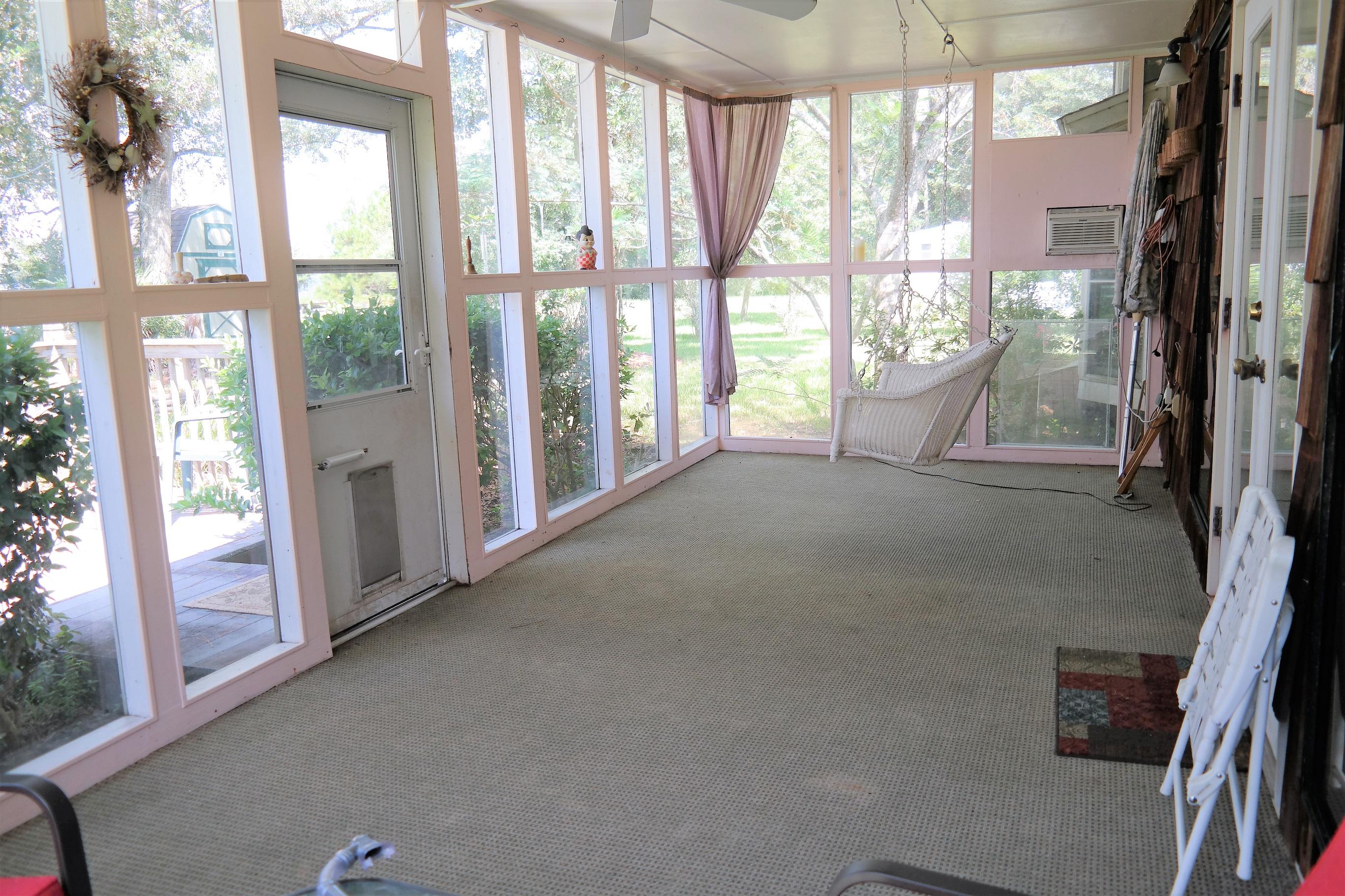 1824 Bay Grove Road Freeport, FL 32439 - Photo 15 of 51 a view of empty room with floor to ceiling window