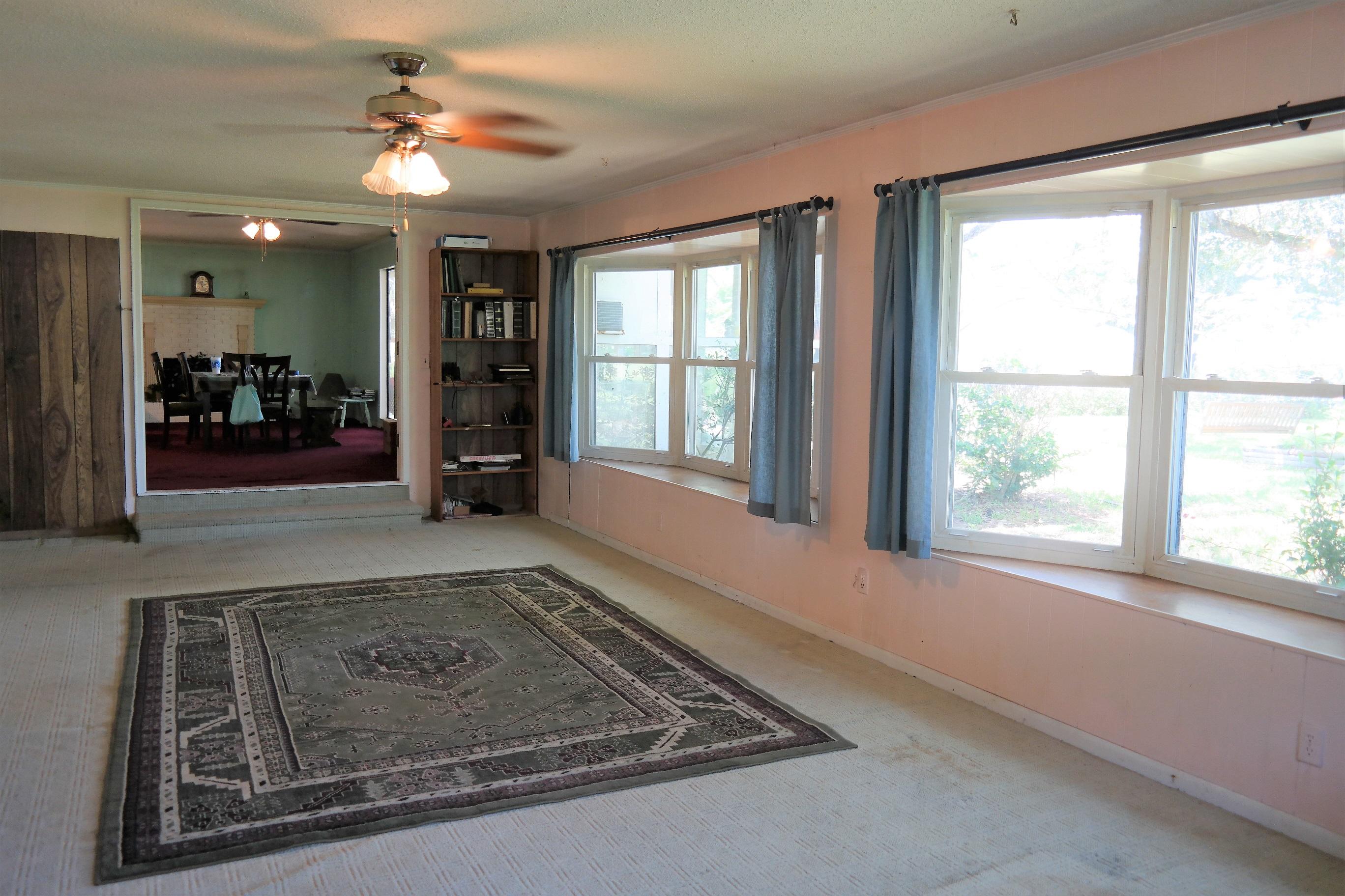 1824 Bay Grove Road Freeport, FL 32439 - Photo 18 of 51 a view of a hallway with a livingroom with furniture