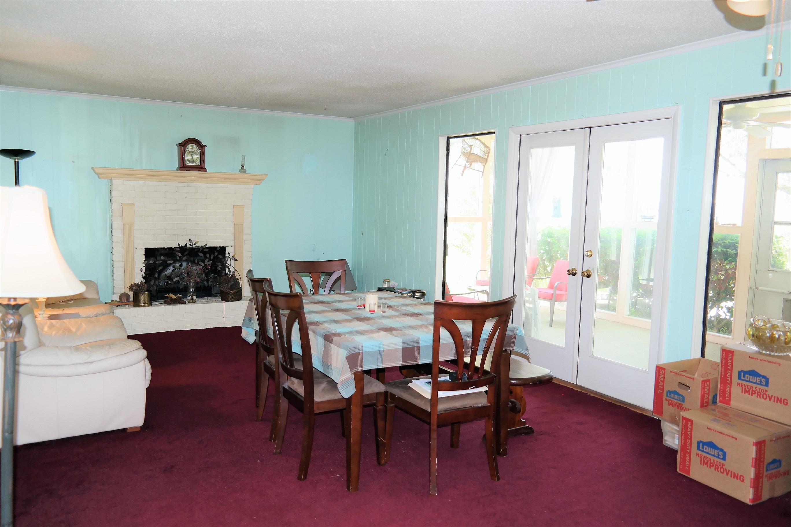 1824 Bay Grove Road Freeport, FL 32439 - Photo 20 of 51 a living room with furniture and a fireplace