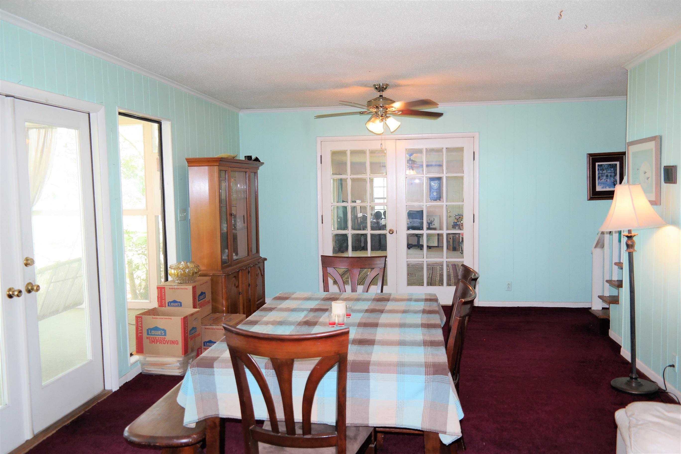 1824 Bay Grove Road Freeport, FL 32439 - Photo 23 of 51 a view of a dining room with furniture window and wooden floor