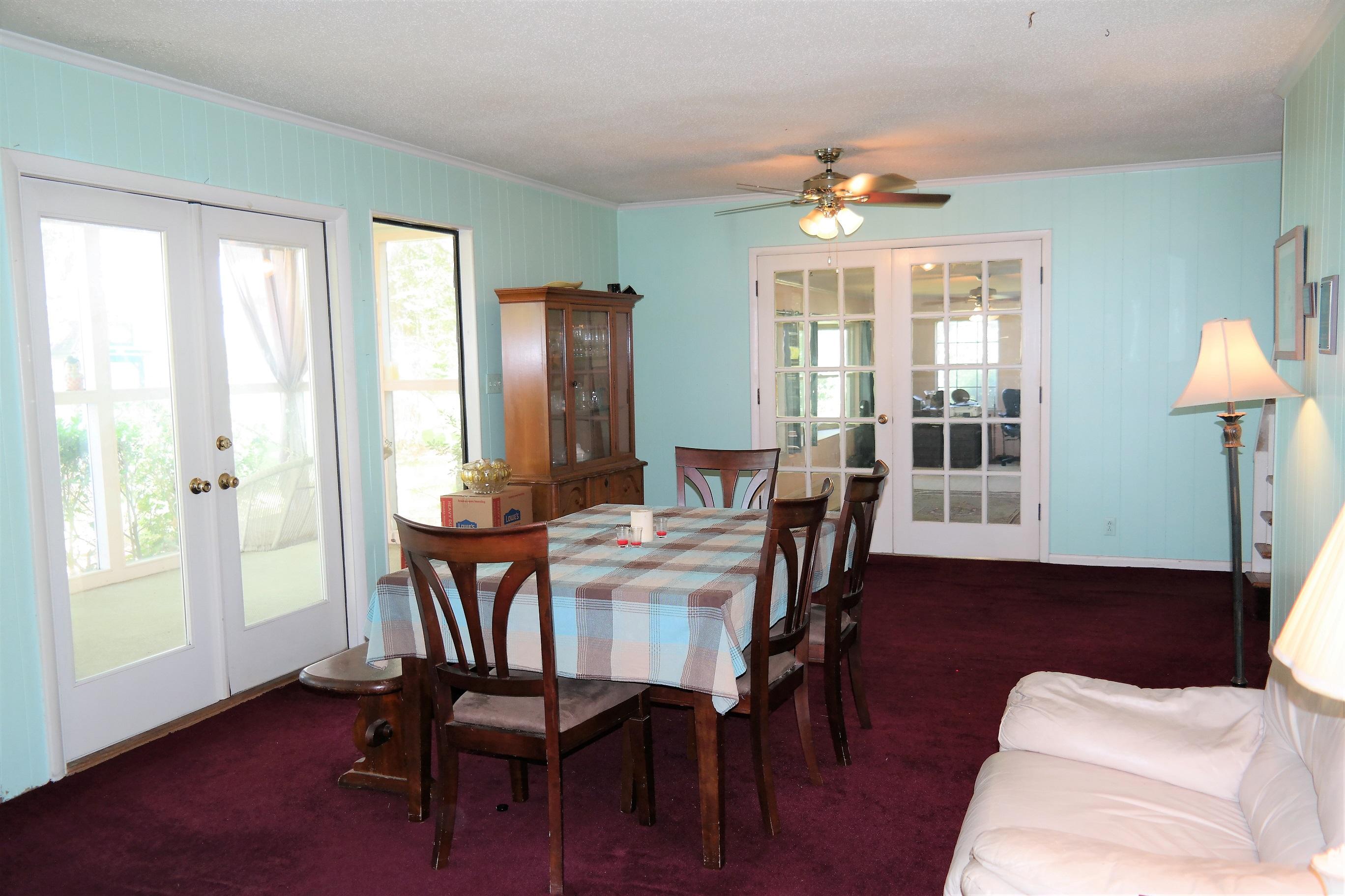 1824 Bay Grove Road Freeport, FL 32439 - Photo 24 of 51 a view of a dining room with furniture window and wooden floor