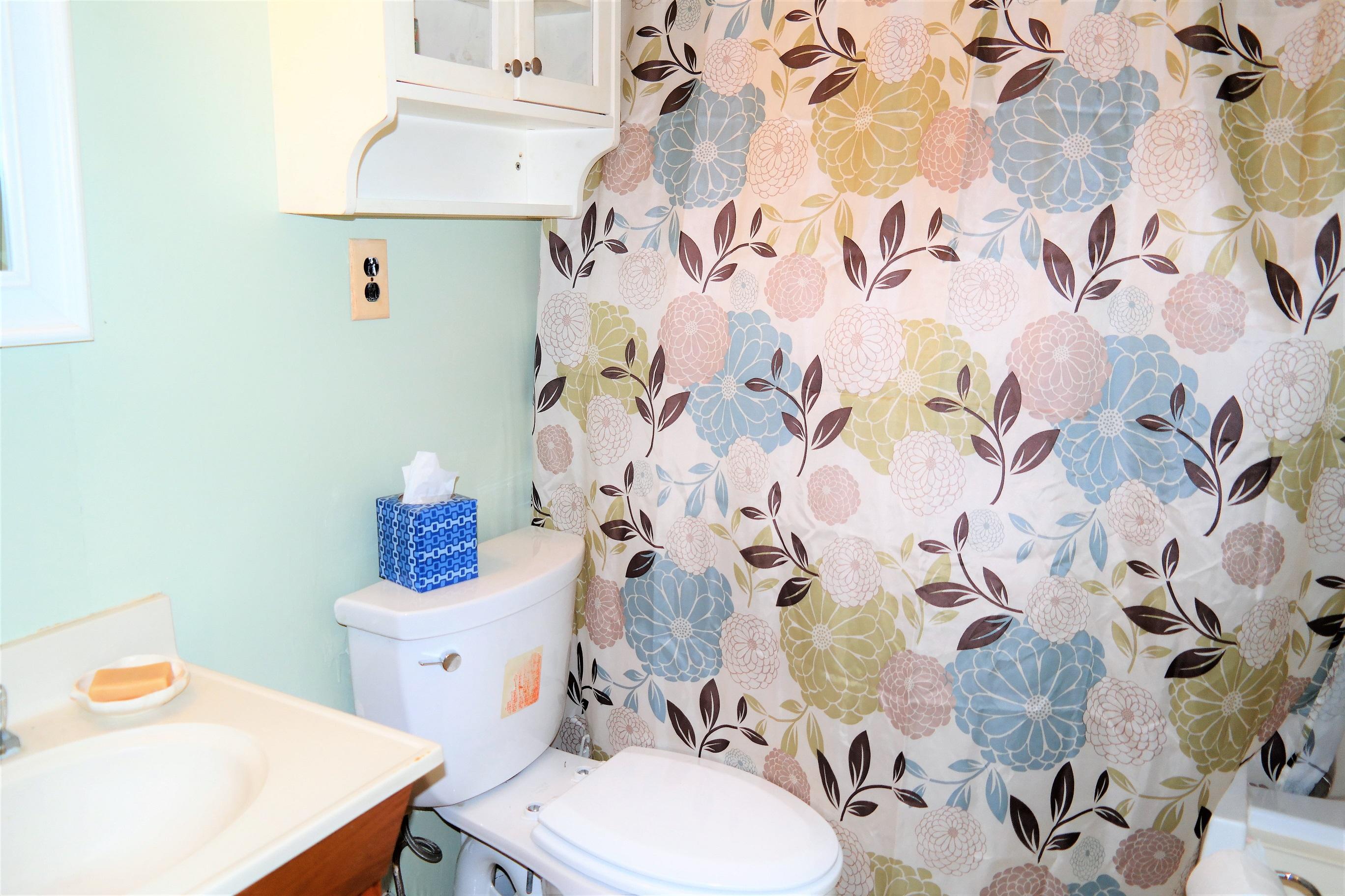 1824 Bay Grove Road Freeport, FL 32439 - Photo 28 of 51 a bathroom with a sink toilet and a mirror