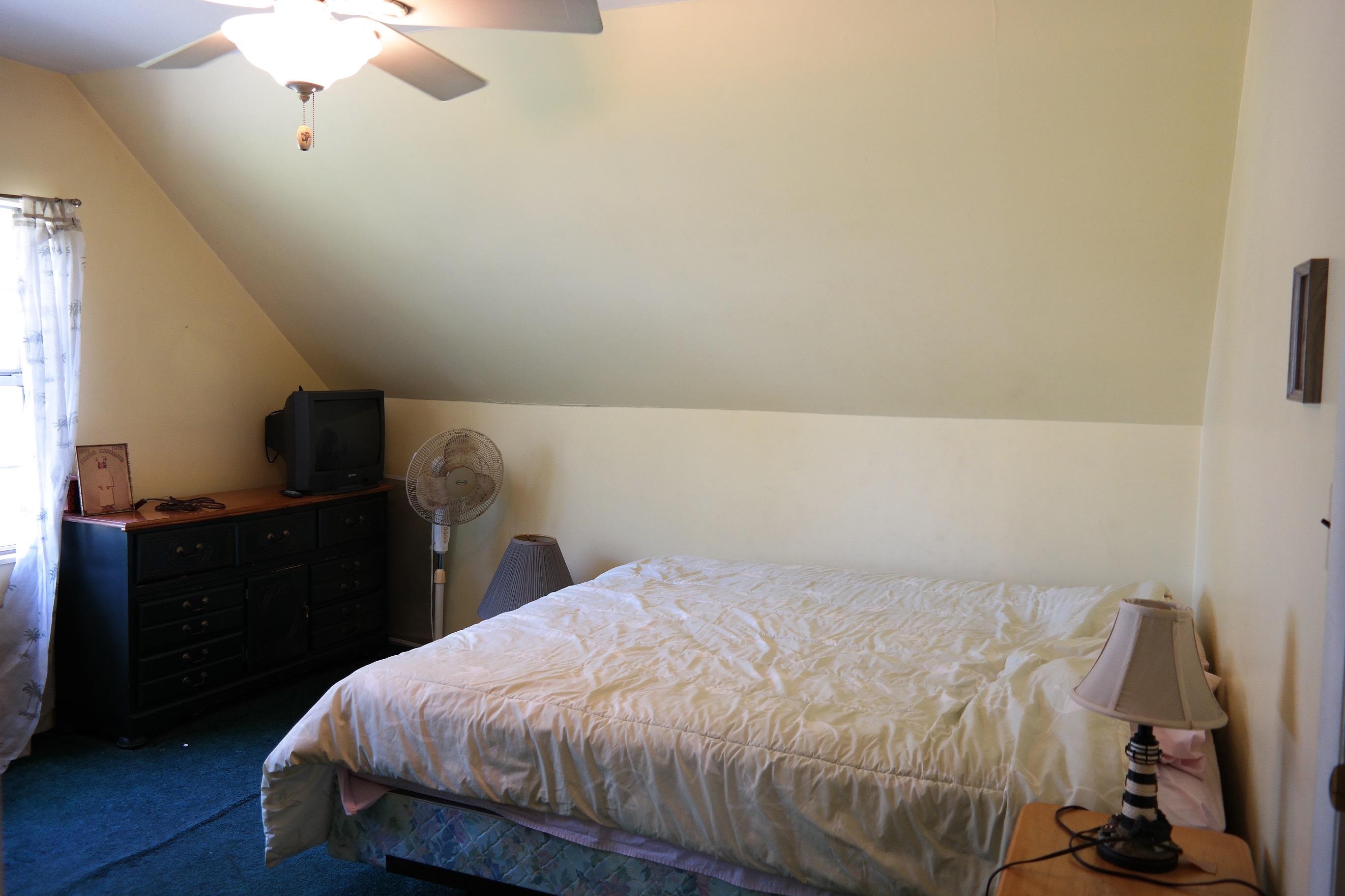 1824 Bay Grove Road Freeport, FL 32439 - Photo 30 of 51 a bedroom with a bed and a chandelier