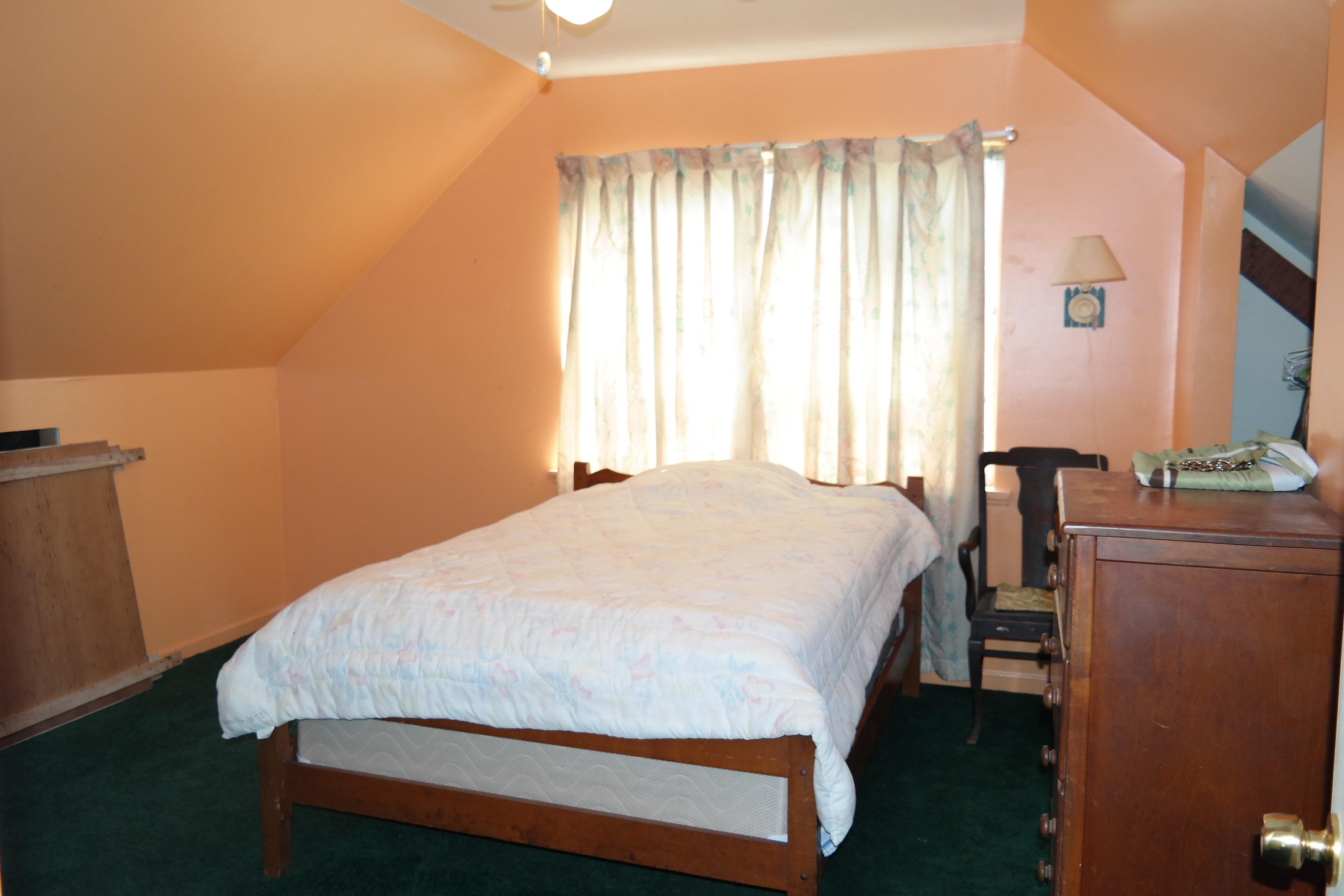 1824 Bay Grove Road Freeport, FL 32439 - Photo 31 of 51 a bed sitting in a bedroom next to a window