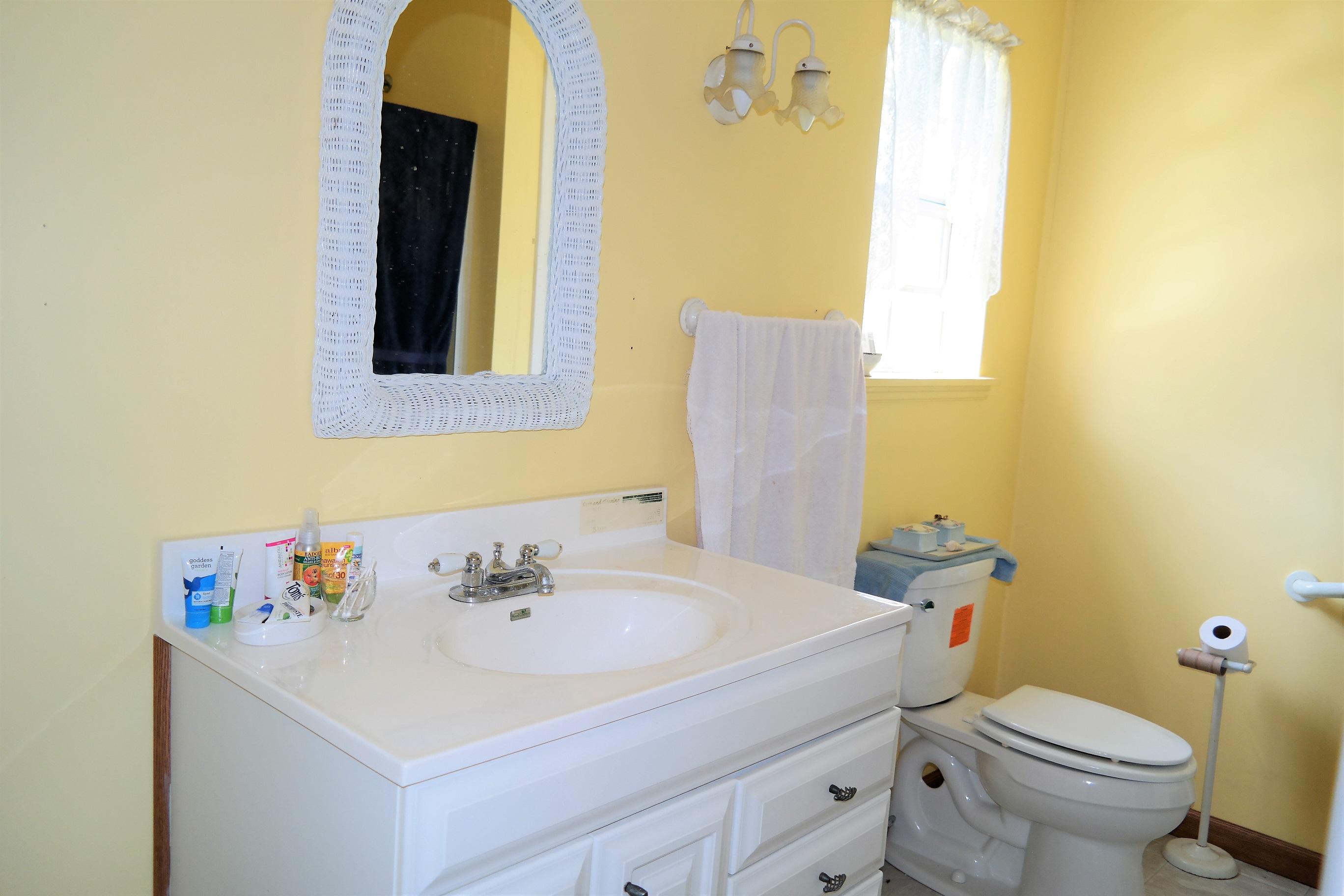1824 Bay Grove Road Freeport, FL 32439 - Photo 33 of 51 a bathroom with a sink and a mirror