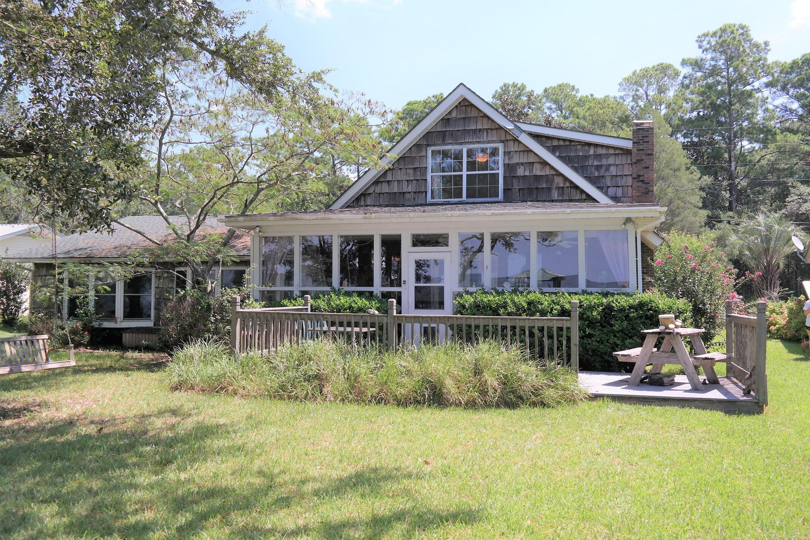 1824 Bay Grove Road Freeport, FL 32439 - Photo 39 of 51 a view of a house with furniture and garden