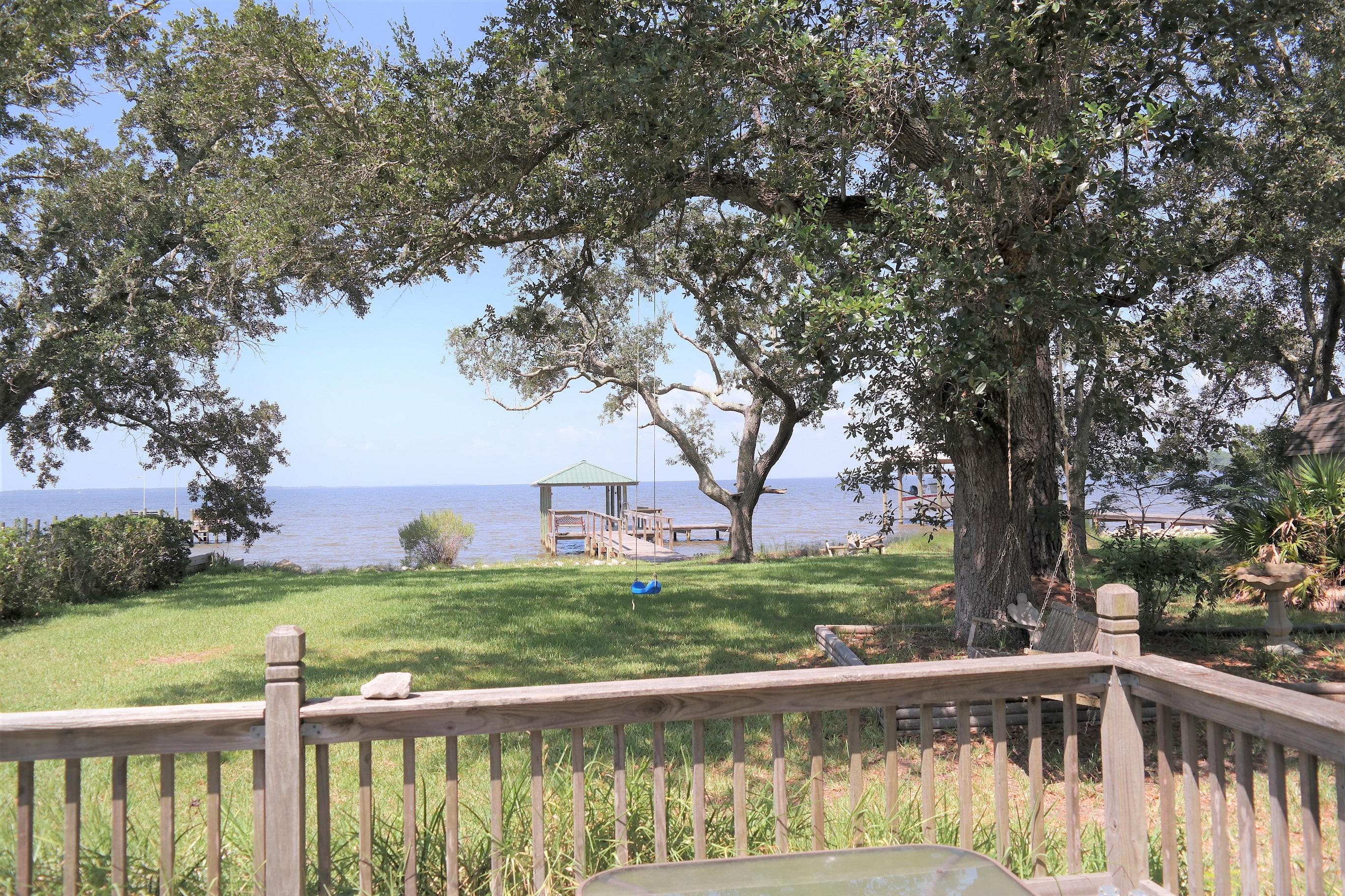 1824 Bay Grove Road Freeport, FL 32439 - Photo 4 of 51 a view of lake with a yard