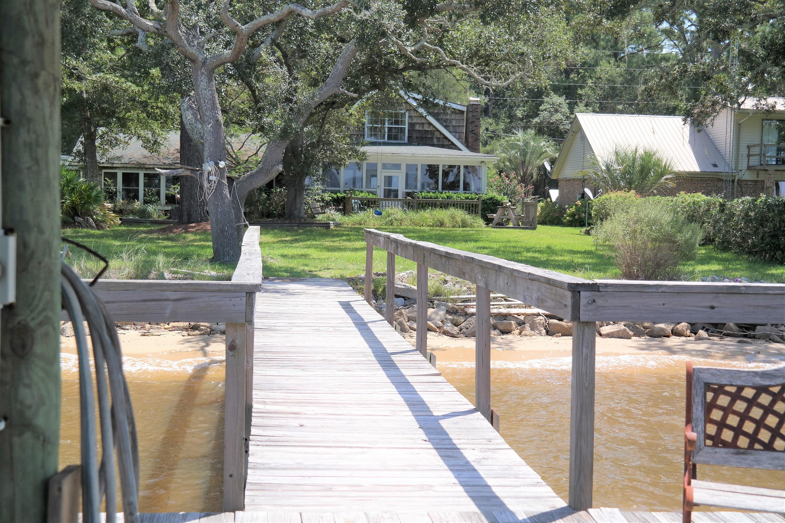 1824 Bay Grove Road Freeport, FL 32439 - Photo 46 of 51 a view of a house with backyard porch and sitting area