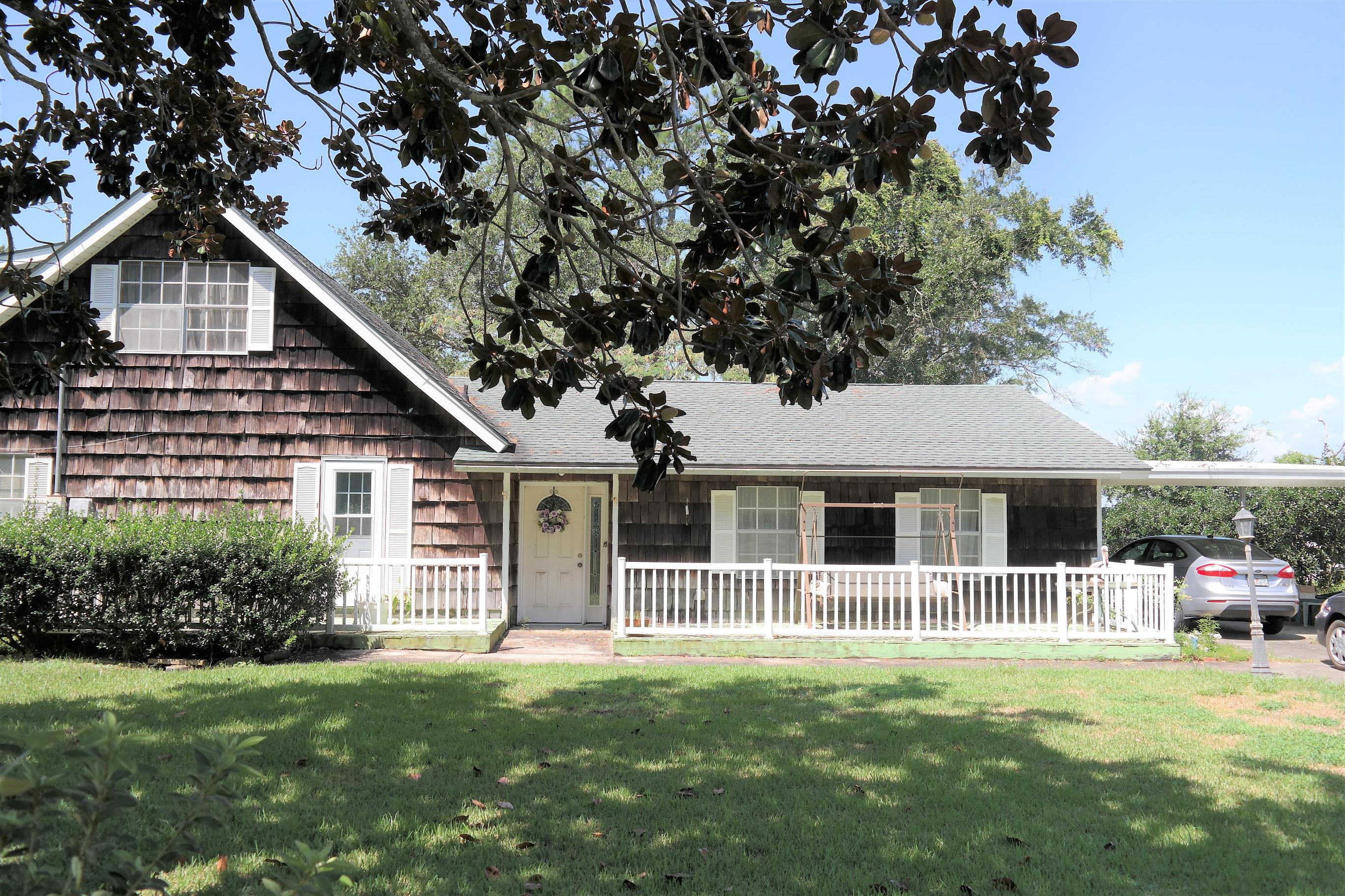 1824 Bay Grove Road Freeport, FL 32439 - Photo 48 of 51 a front view of a house with a garden