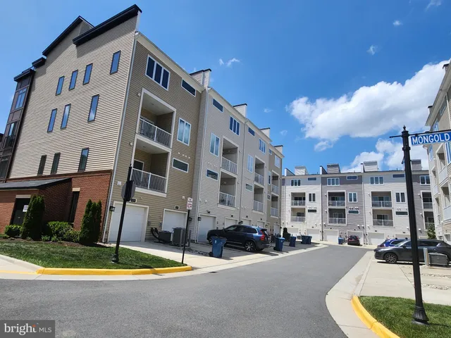 a view of tall buildings in the street