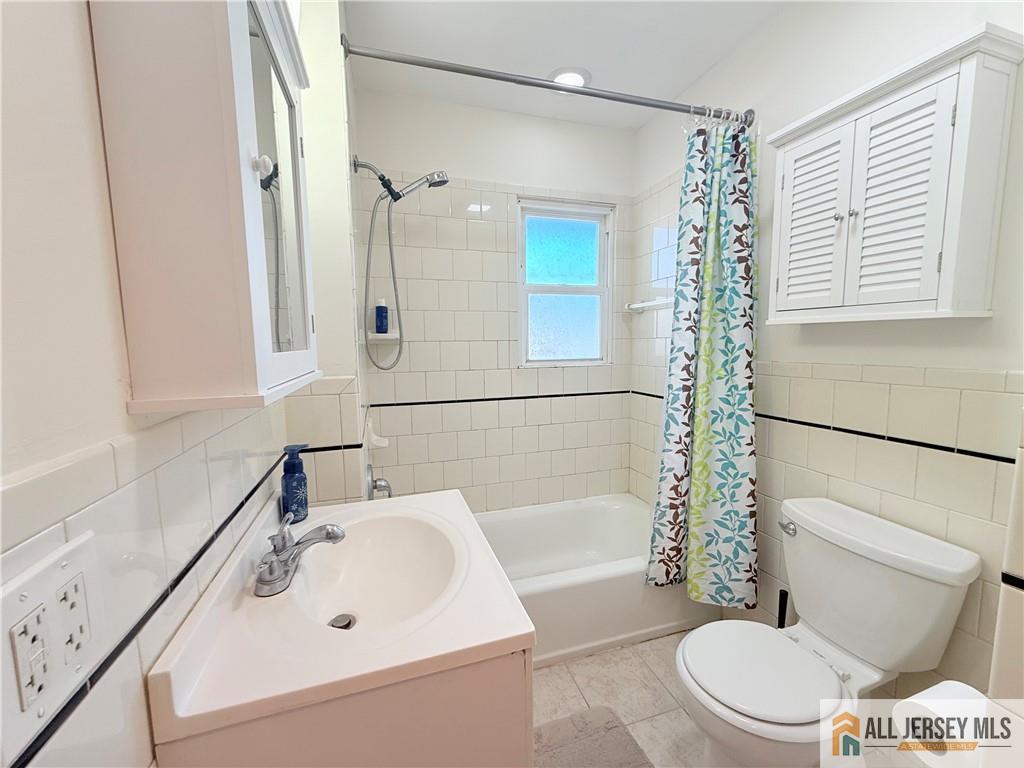 10 Hamilton Avenue Edison, NJ 08820 - Photo 4 of 10 a bathroom with a sink toilet and shower