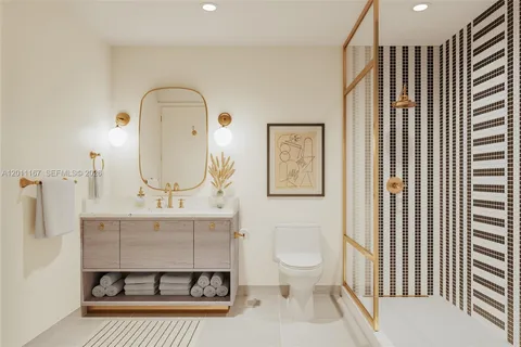 a bathroom with a sink toilet a mirror and shower