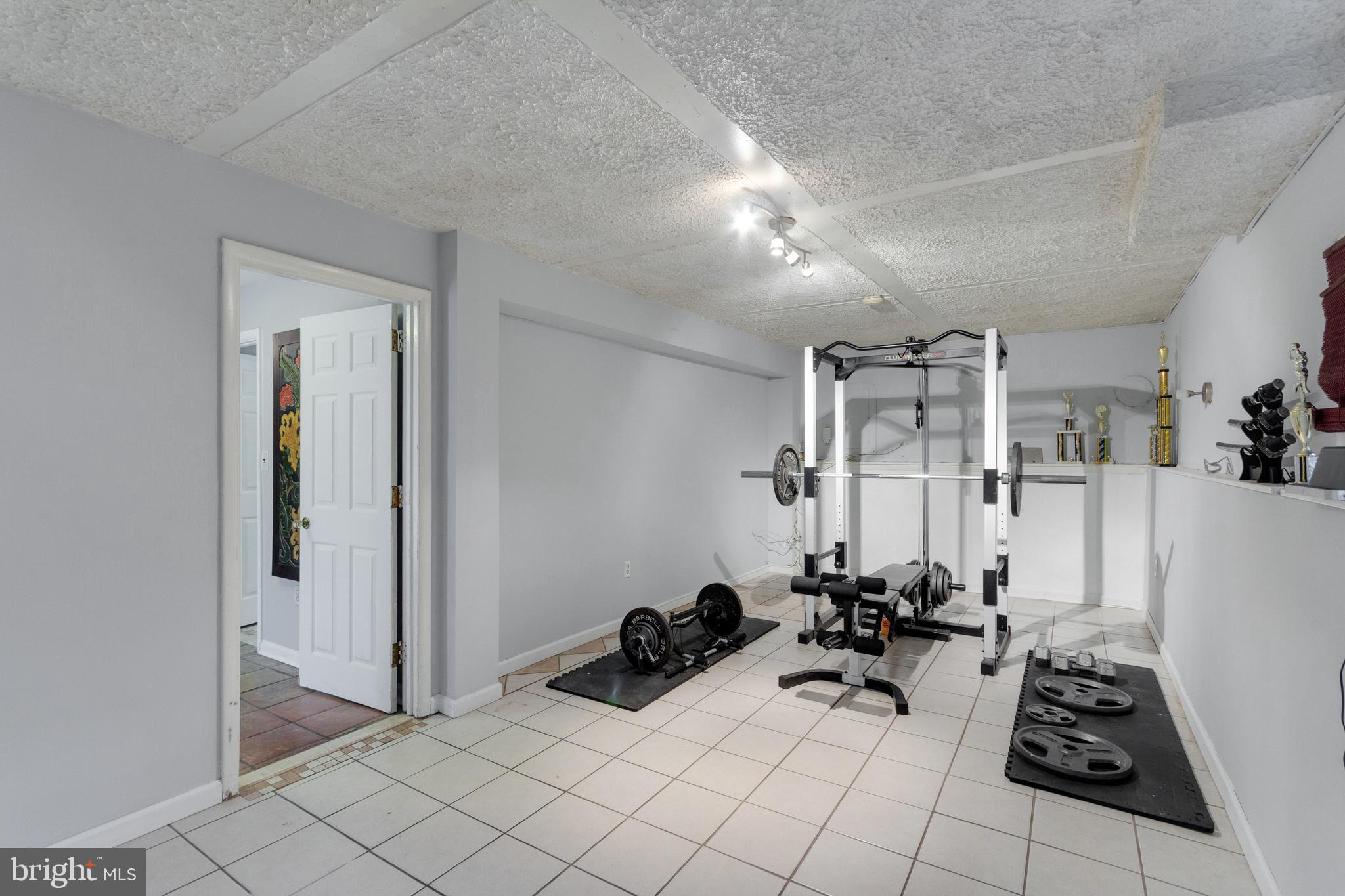 218 Ridgely Road Glen Burnie, MD 21061 - Photo 22 of 25 Family room/ gym /rec room / possible 5th bedroom!