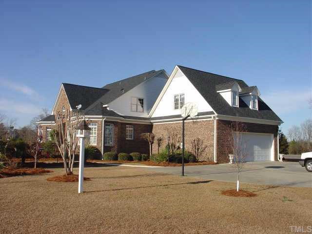 390 Dogeye Road Benson, NC 27504 - Photo 8 of 10 Side view of the home. Beautiful landscaping.