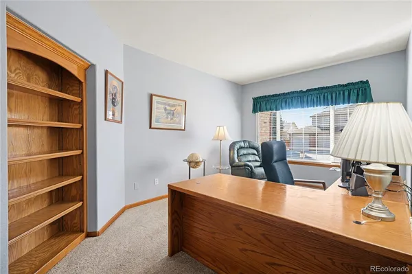 a view of living room with furniture and window