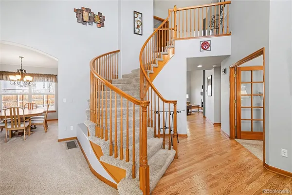 a view of staircase with furniture and a large window