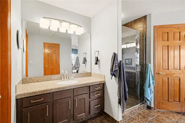 a bathroom with a sink a vanity and a mirror