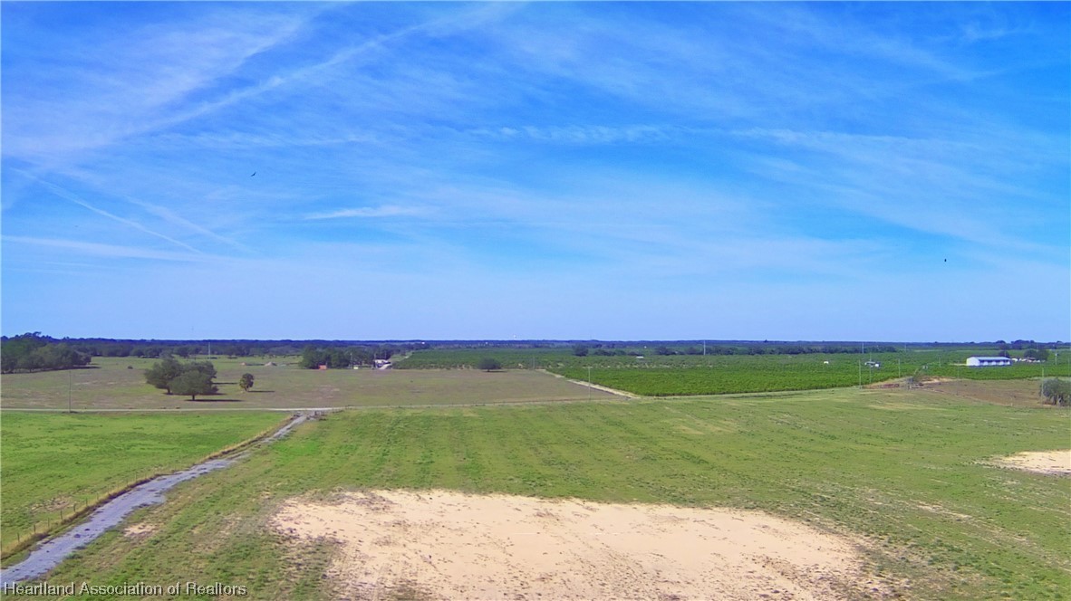 623 Old Avon Road Frostproof, FL 33843 - Photo 9 of 40 a view of a field with an trees in the background