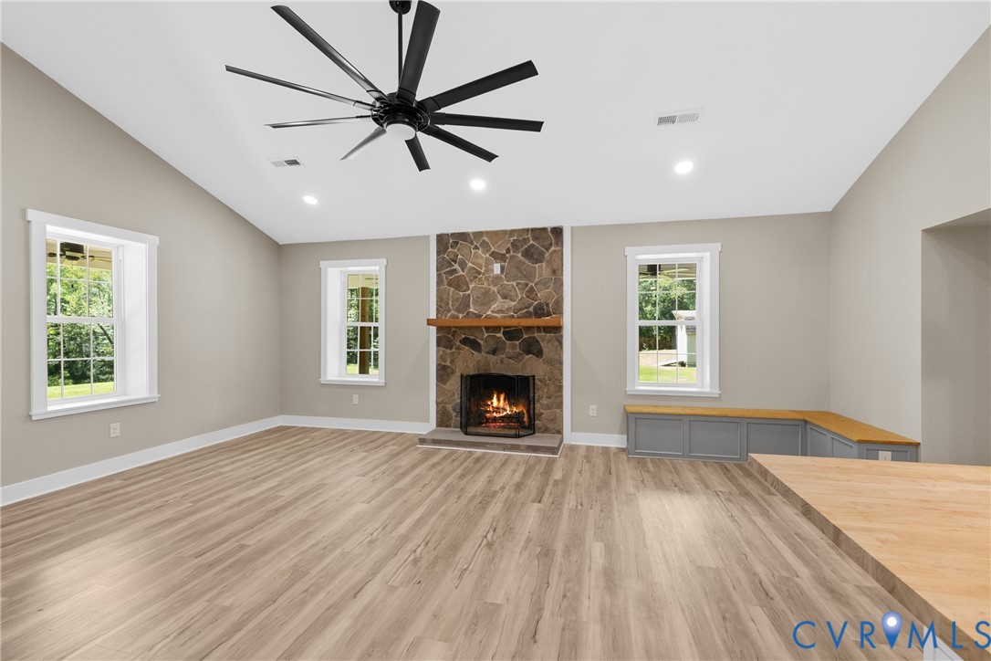 11905 Quaker Road Dinwiddie, VA 23841 - Photo 11 of 34 Vaulted ceiling, stone-clad fireplace with wood ma