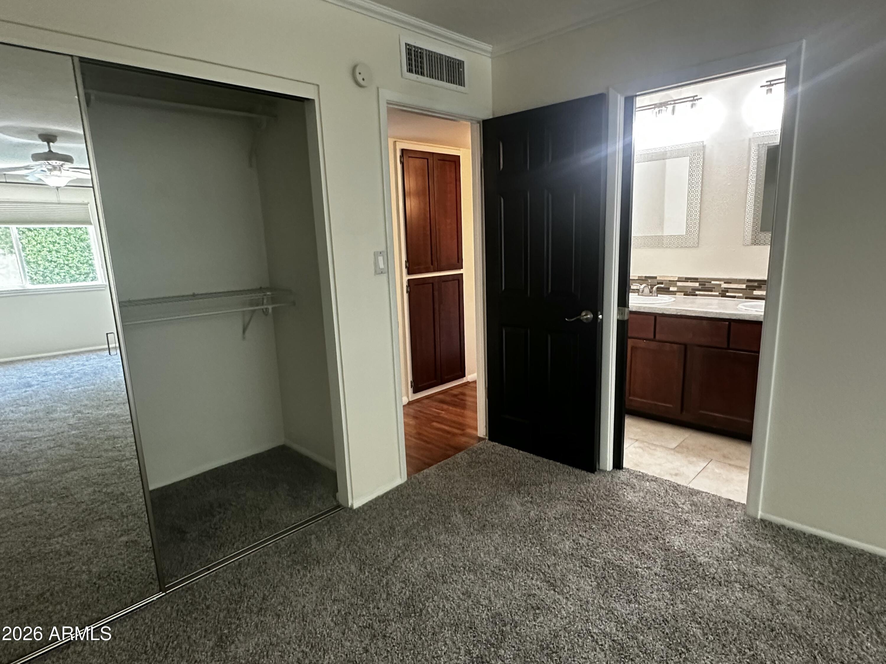 8737 East Jackrabbit Road Scottsdale, AZ 85250 - Photo 18 of 25 Primary closet and bathroom