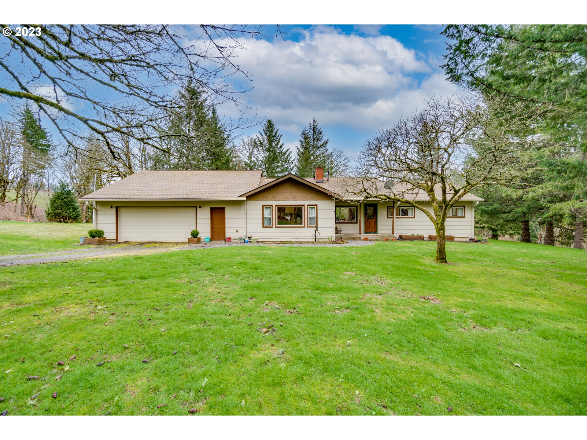1515 Southeast Northway Road Corbett, OR 97019 - Photo 1 of 32 a front view of a house with a yard