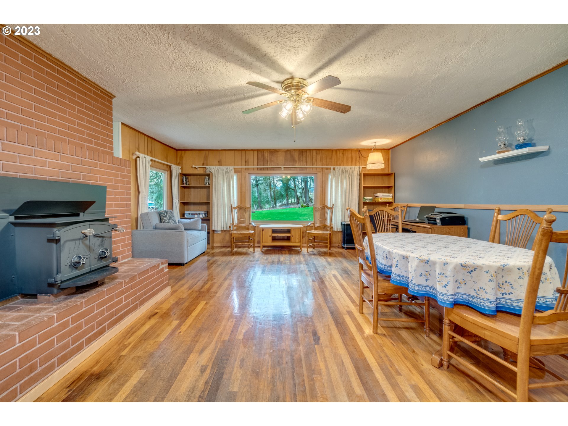 1515 Southeast Northway Road Corbett, OR 97019 - Photo 16 of 32 a living room with furniture and a wooden floor