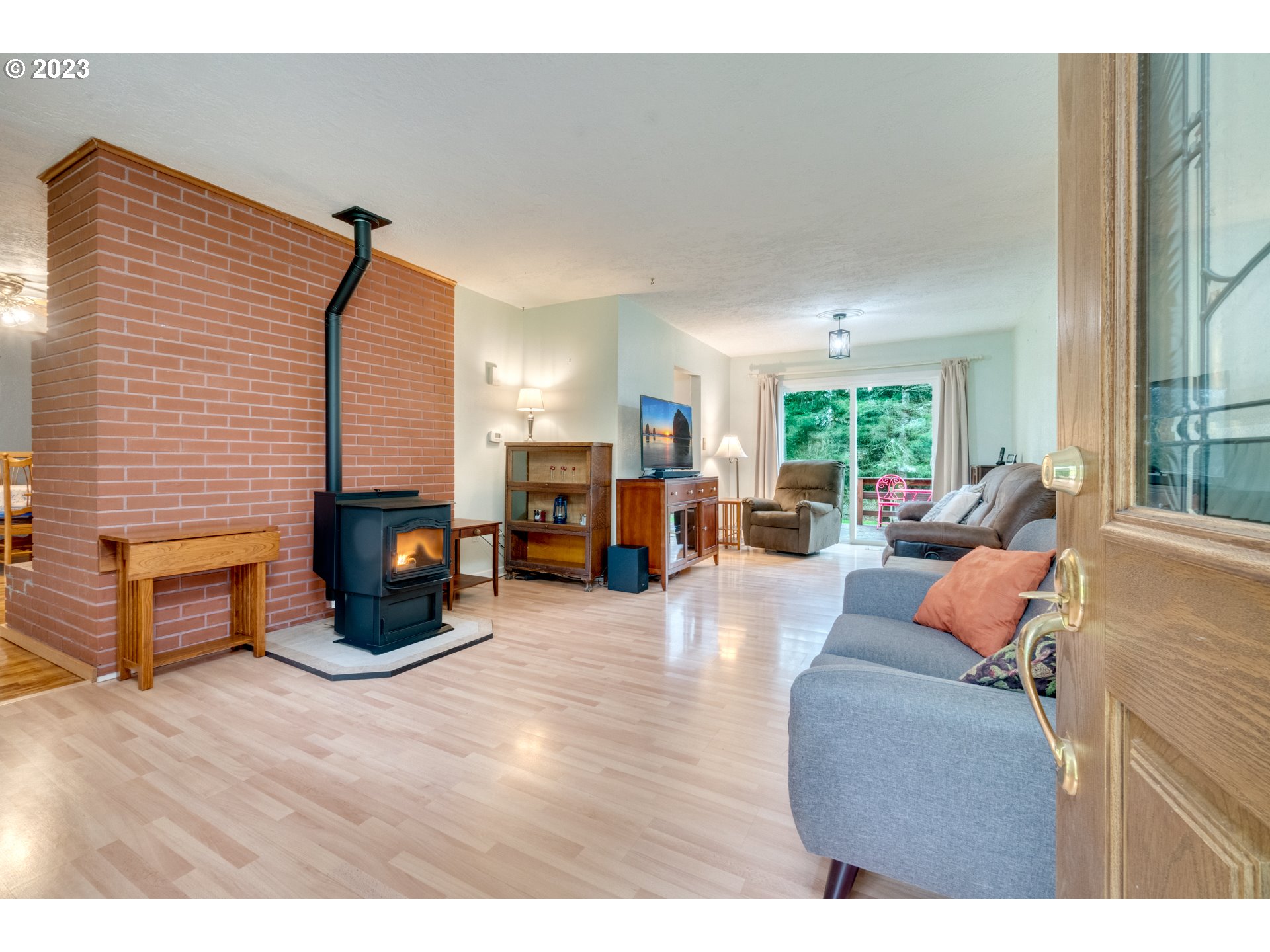 1515 Southeast Northway Road Corbett, OR 97019 - Photo 7 of 32 a living room with furniture and a fireplace