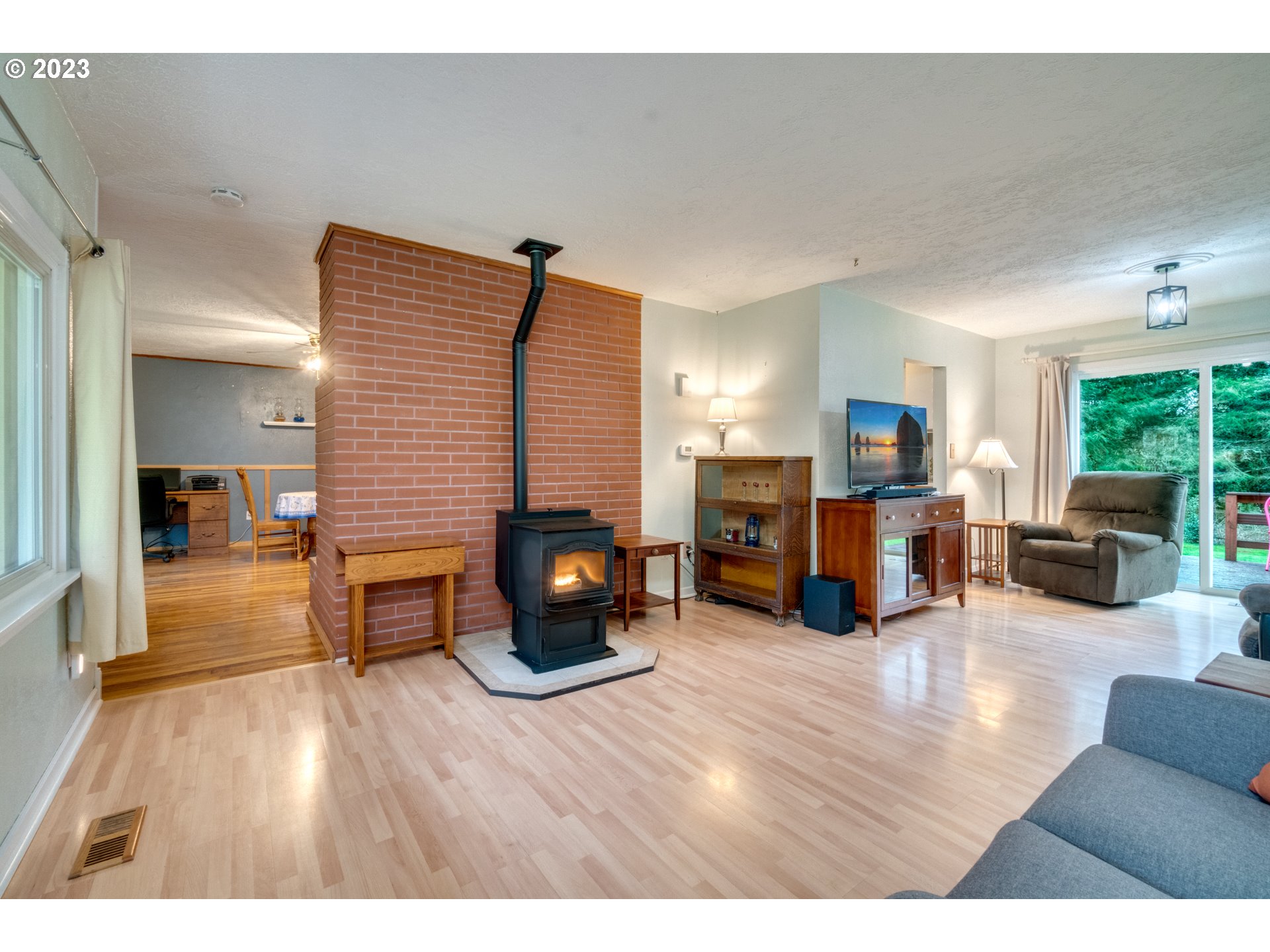 1515 Southeast Northway Road Corbett, OR 97019 - Photo 8 of 32 a living room with furniture and a fireplace