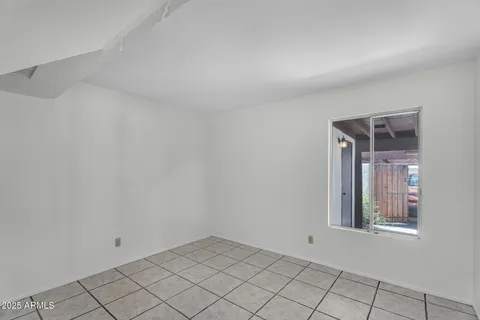 a bath tub sitting next to a white toilet