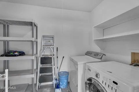 a bathroom with a sink mirror toilet and bathtub