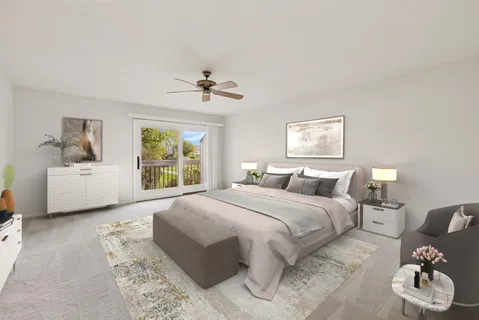 a spacious bedroom with a bed and window