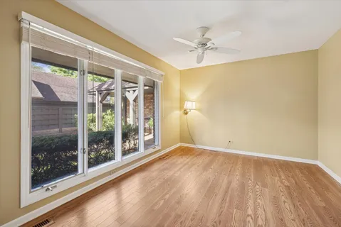 a view of an empty room with a window